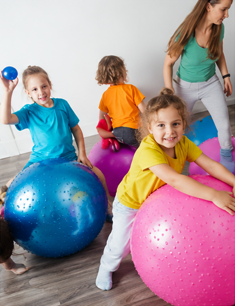 Children playing with colorful exercise balls